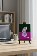 Tiger Purple Black print on a stand next to a laptop