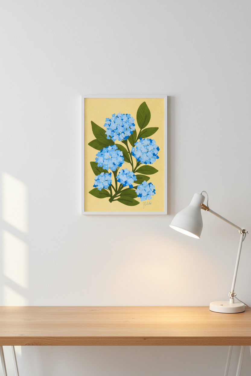 Hydrangea on Yellow print framed next to a desk lamp