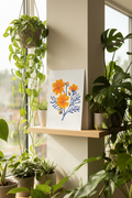 Cosmos print displayed with houseplants